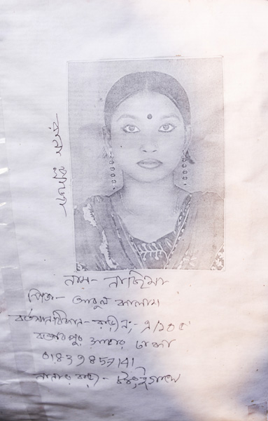 <p>[Handwritten, left side of photo] Rana Plaza<br />NAME: Nasima<br />FATHER: Abul Kalam<br />PRESENT ADDRESS: A/105 Boktarpur, Savar, Dhaka<br />[MOBILE]: 01839857141<br />Maternal grandfather’s home [DISTRICT]: Tangail<br /><br /></p>